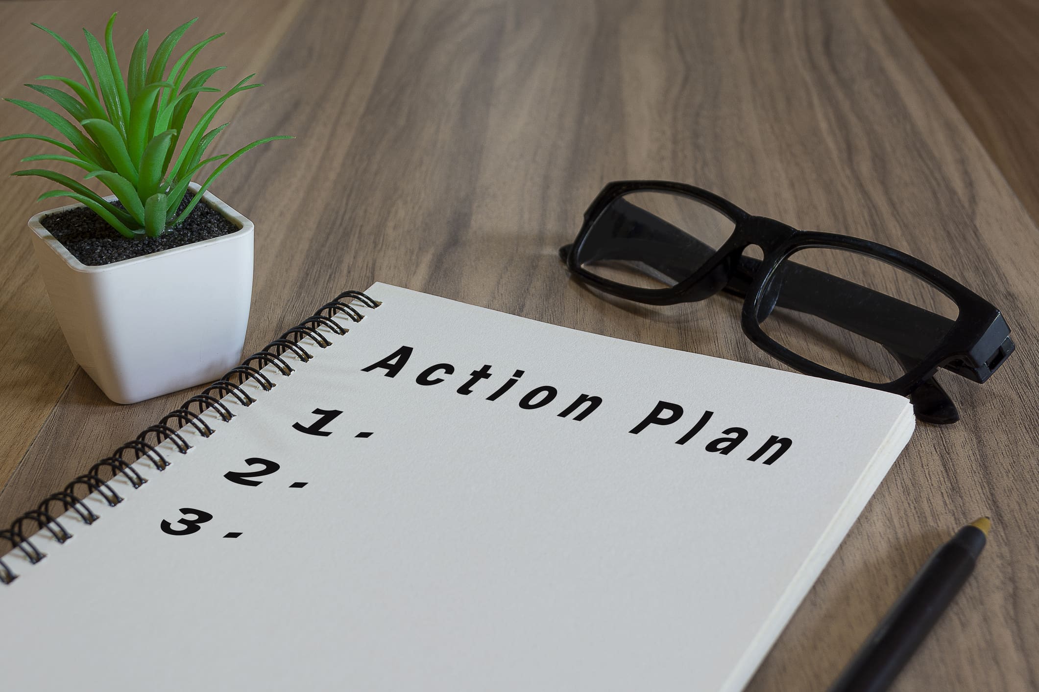 note pad with the words action plan