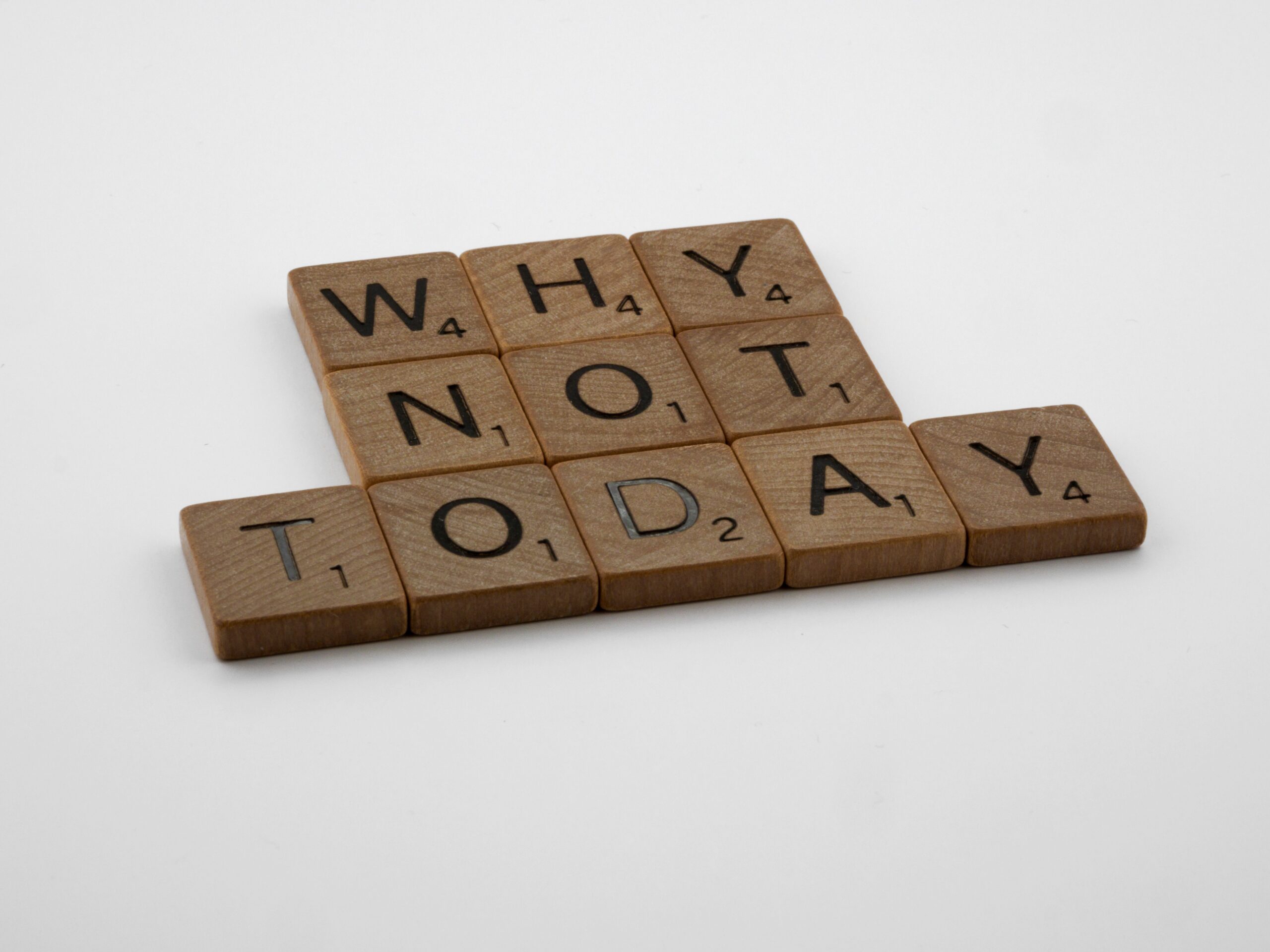wood blocks spelling out why not today